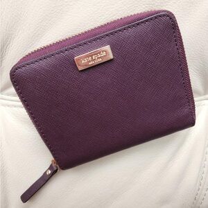 NWOT Kate Spade bifold wallet in burgundy-wine color.